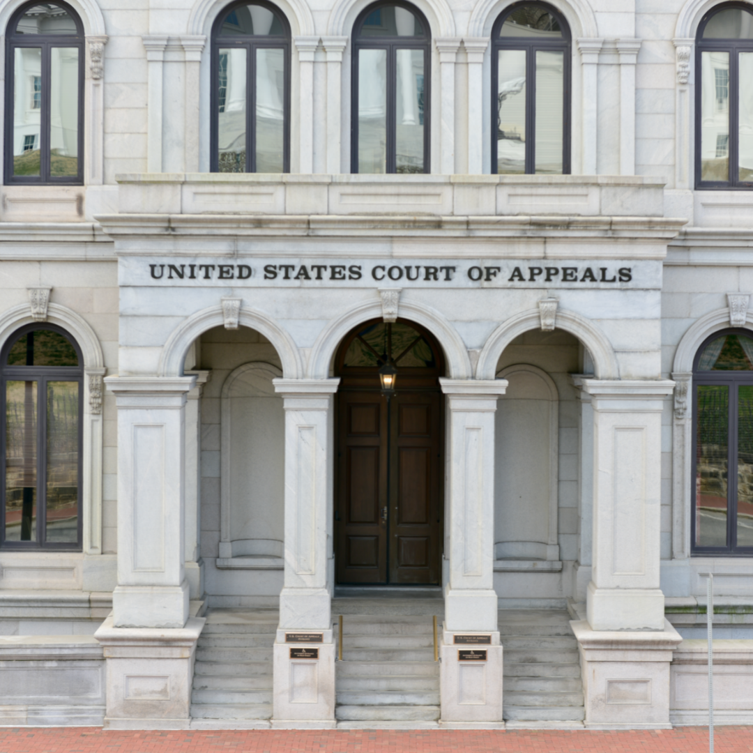 A photograph of part of a marble courthouse with the words "United States Court of Appeals" in capital black letters.