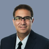 Headshot of attorney David Leichtman with grayish blue background.