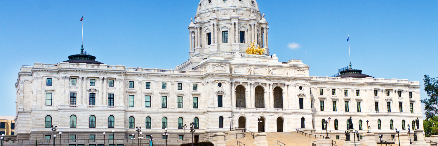 Photograph of a white marble courthouse with a dome.