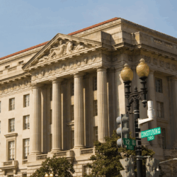 White Collar Litigation & Investigations Photograph of a stone Roman style building with a red tile roof.